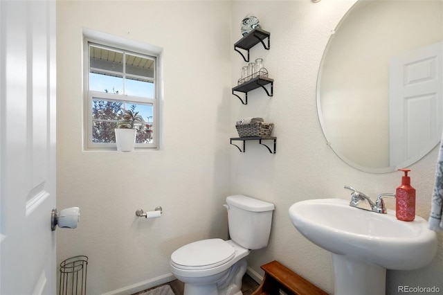 bathroom featuring sink and toilet