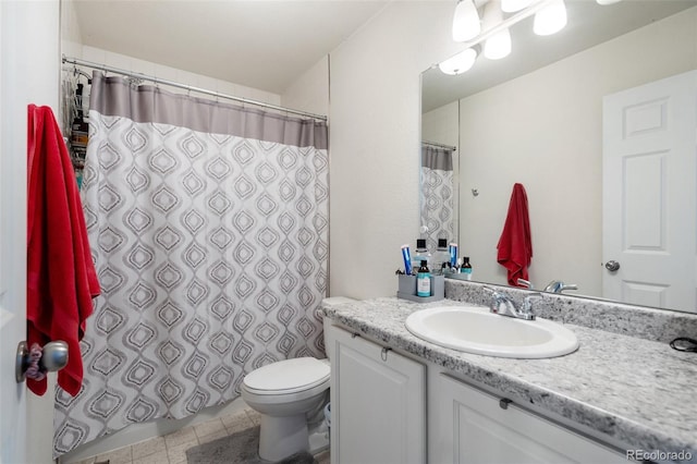 bathroom with a shower with curtain, tile patterned floors, vanity, and toilet