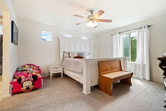 bedroom with ceiling fan and carpet