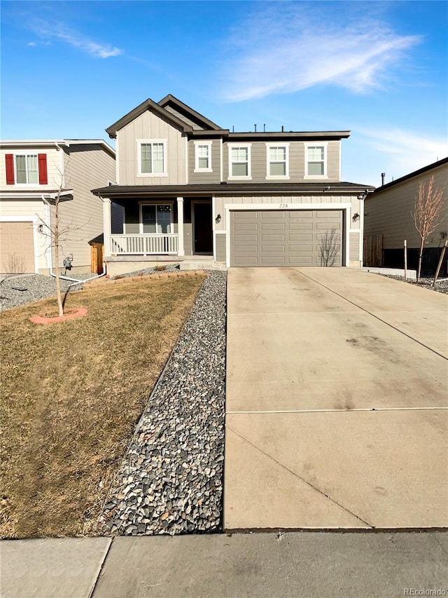 view of front of home featuring covered porch, concrete driveway, board and batten siding, and an attached garage