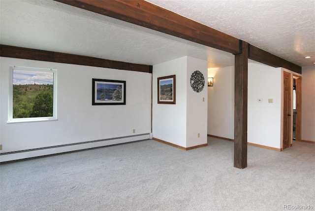 101 Ryan Gulch Ct Unit A202, Silverthorne, CO 80498 - unfurnished room with a baseboard radiator, a textured ceiling, and carpet