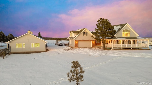 view of front of house with a porch and a garage