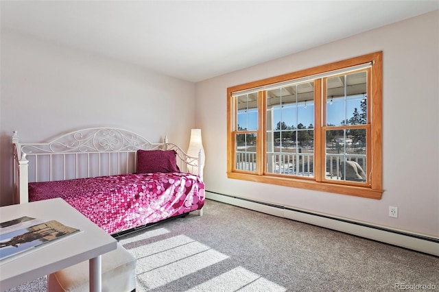 bedroom with carpet floors and baseboard heating