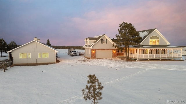 view of front facade with a garage and a porch