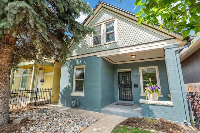 269 Delaware St, Denver, CO 80223 - view of front of home with brick siding and covered porch