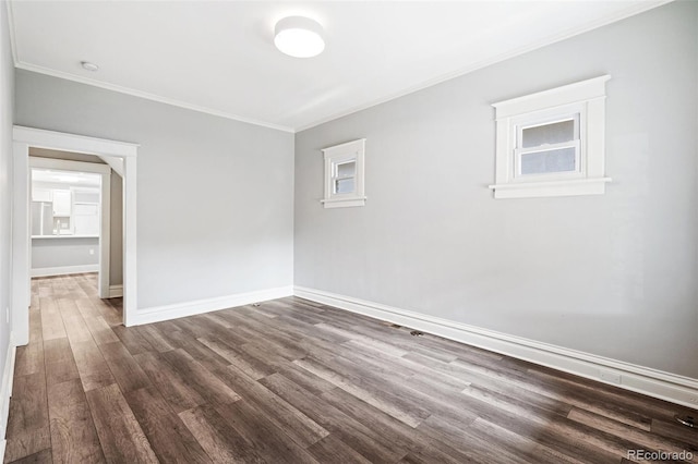 269 Delaware St, Denver, CO 80223 - spare room with crown molding, dark wood finished floors, and a smoke detector