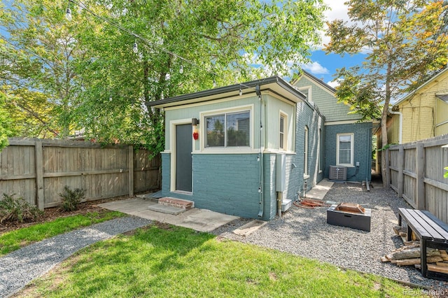 269 Delaware St, Denver, CO 80223 - view of outbuilding featuring an outdoor fire pit and a fenced backyard