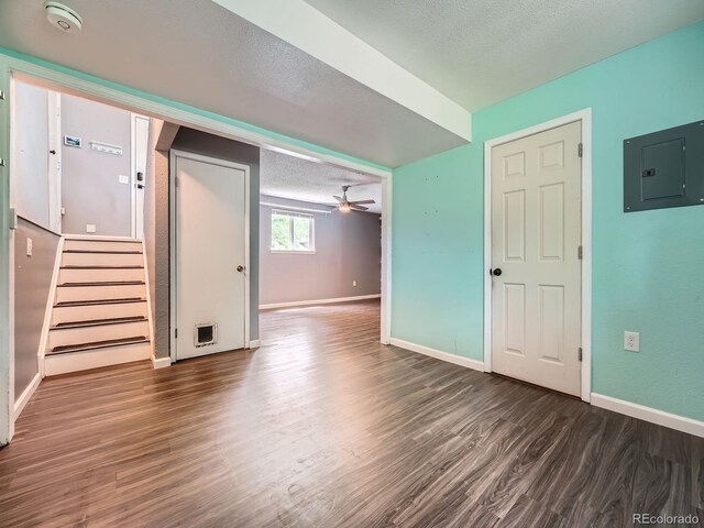 12991 E Idaho Dr, Aurora, CO 80012 - unfurnished living room with electric panel, wood finished floors, baseboards, stairs, and ceiling fan