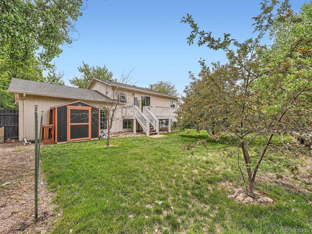 12991 E Idaho Dr, Aurora, CO 80012 - back of house featuring stairs and a wooden deck