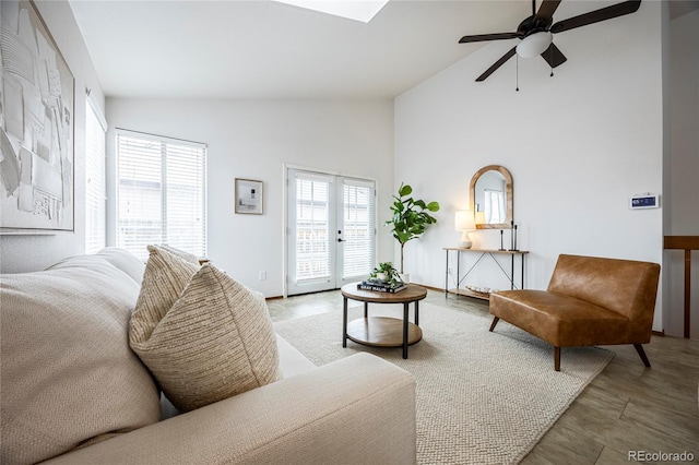 living room with french doors, high vaulted ceiling, and ceiling fan