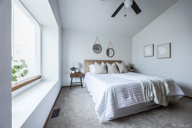 bedroom with carpet, vaulted ceiling, and ceiling fan