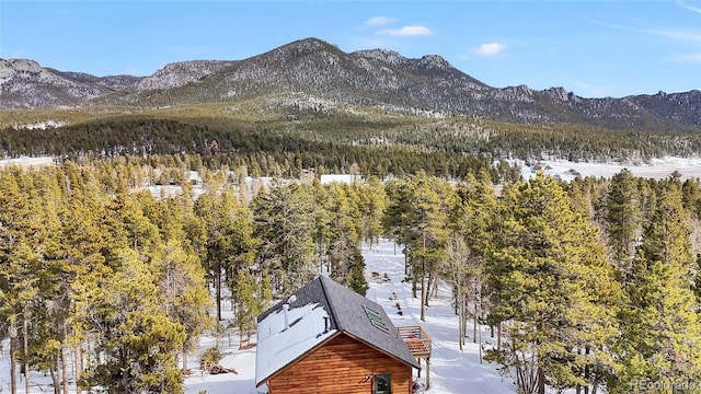 mountain view featuring a view of trees