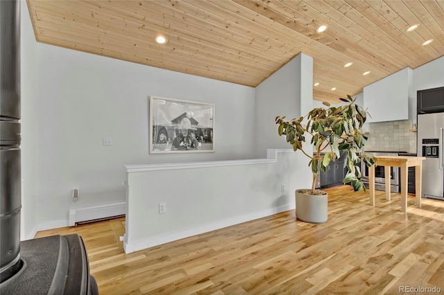 kitchen with lofted ceiling, wooden ceiling, high quality fridge, and decorative backsplash