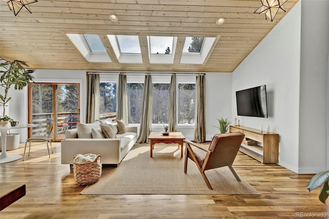 sunroom / solarium with lofted ceiling with skylight and wood ceiling