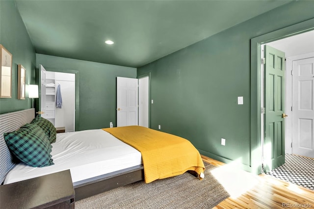 bedroom featuring wood finished floors