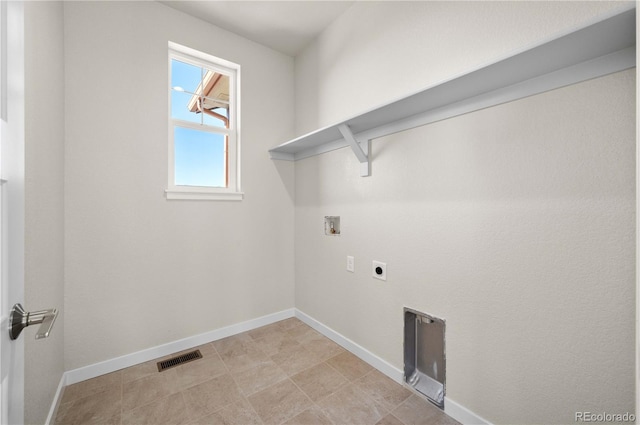 laundry area featuring washer hookup, visible vents, electric dryer hookup, laundry area, and baseboards