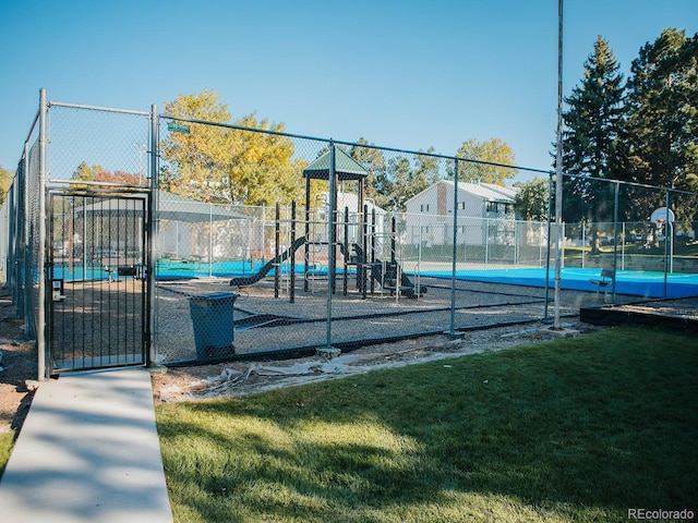 exterior space with fence and a lawn