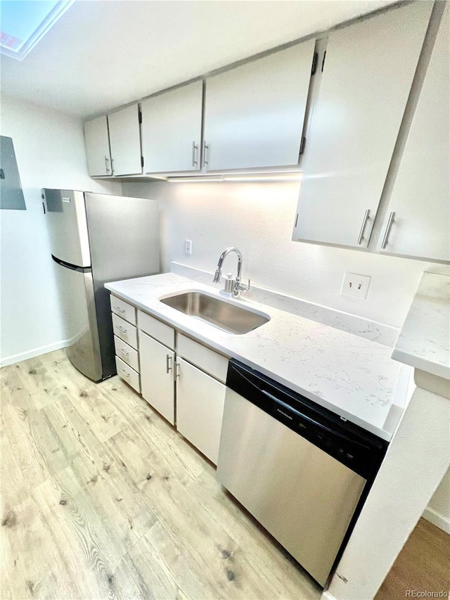 14413 E Jewell Ave Unit 201, Aurora, CO 80012 - kitchen featuring appliances with stainless steel finishes and light wood-style floors