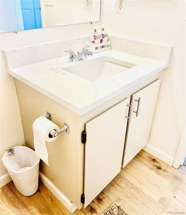 14413 E Jewell Ave Unit 201, Aurora, CO 80012 - bathroom featuring wood finished floors and vanity