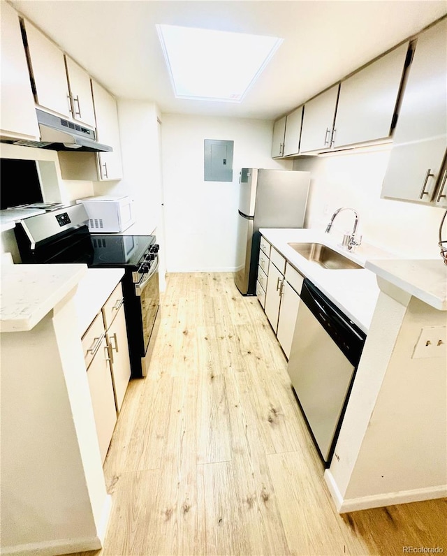 14413 E Jewell Ave Unit 201, Aurora, CO 80012 - kitchen featuring stainless steel appliances, light wood-style flooring, electric panel, and light countertops