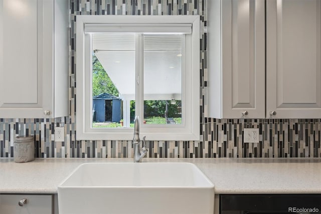 269 Beryl Way, Broomfield, CO 80020 - kitchen with a sink, dishwashing machine, and backsplash