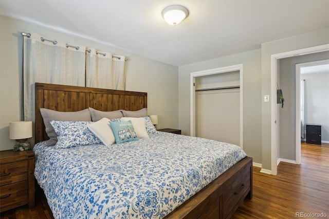 269 Beryl Way, Broomfield, CO 80020 - bedroom with dark wood-style floors, a closet, and baseboards