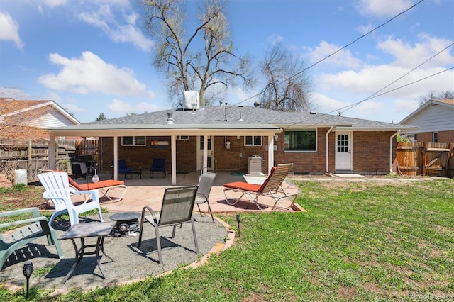 269 Beryl Way, Broomfield, CO 80020 - back of house with a patio and brick siding