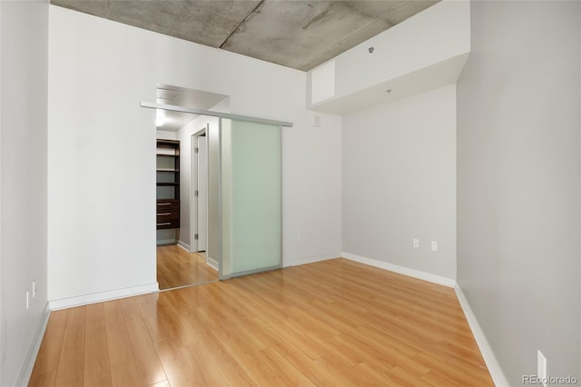 empty room with wood-type flooring