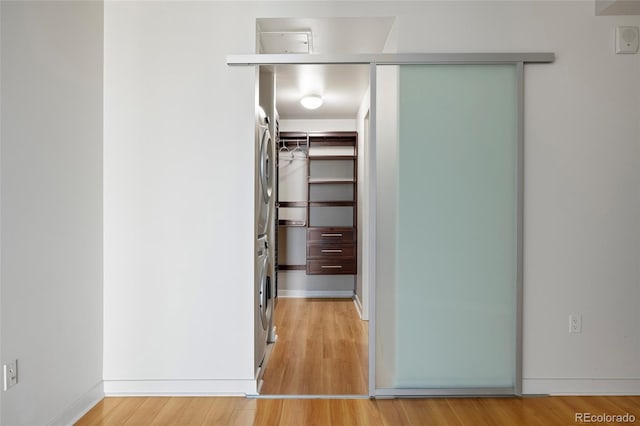 closet with stacked washer / drying machine