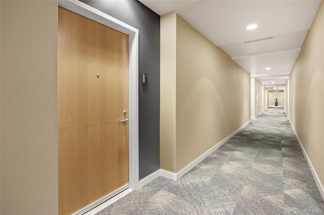 hallway featuring carpet flooring