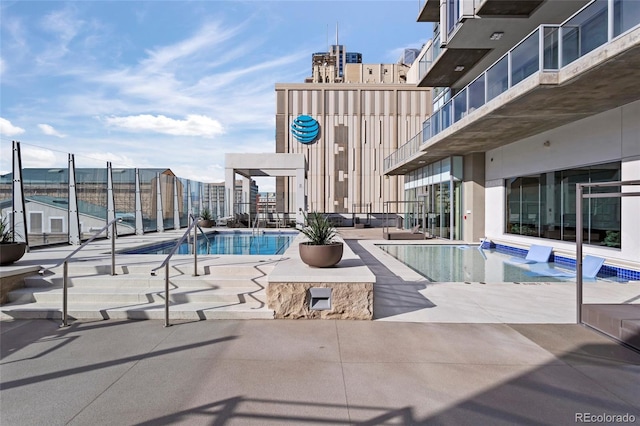 view of swimming pool featuring a patio