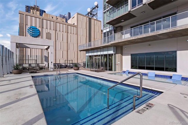 view of swimming pool with a patio