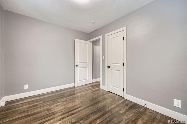 4425 S Lincoln St, Englewood, CO 80113 - unfurnished room featuring dark wood-style flooring and baseboards