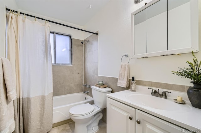 full bathroom with shower / tub combo, vanity, and toilet