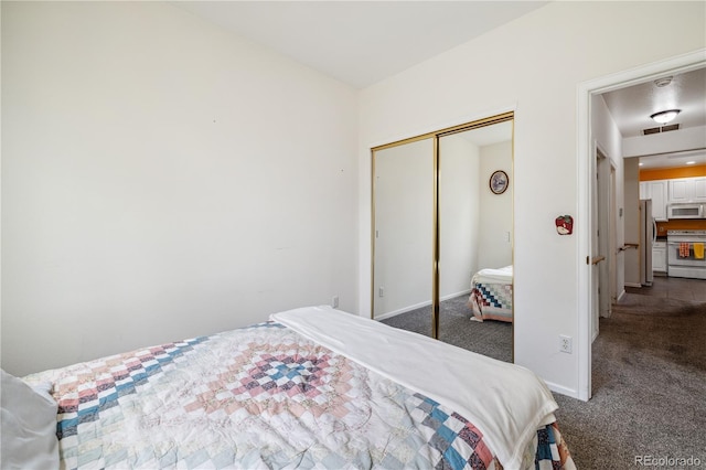 11030 Glacier Park Cir, Parker, CO 80138 - bedroom with freestanding refrigerator, carpet floors, and a closet