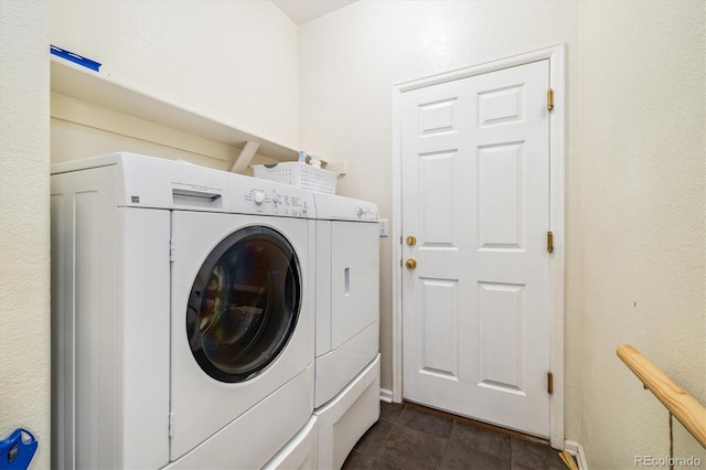 11030 Glacier Park Cir, Parker, CO 80138 - laundry room featuring separate washer and dryer and dark tile patterned flooring