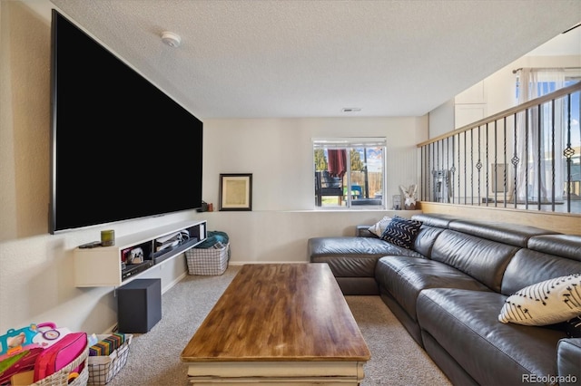 living room featuring carpet flooring and a textured ceiling