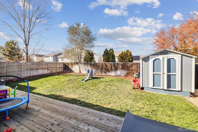 view of yard featuring a shed and a deck