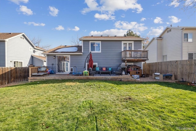 back of house with a yard and a wooden deck