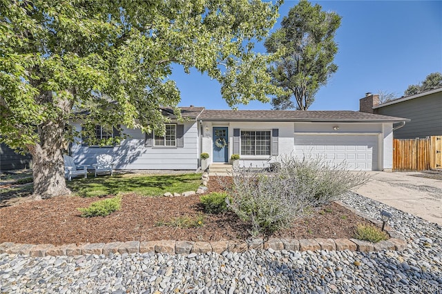 ranch-style home featuring a garage