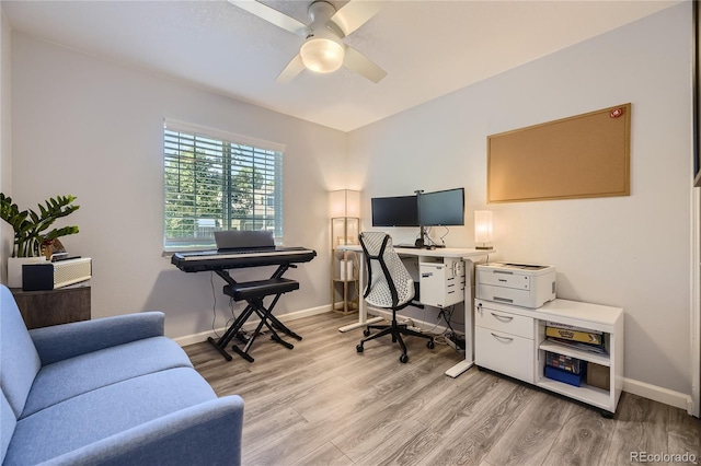 office area with ceiling fan and light hardwood / wood-style floors