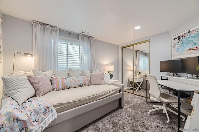 bedroom with carpet floors and a closet