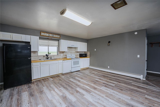 9940 N Calhan Hwy, Calhan, CO 80808 - kitchen with black appliances, a baseboard heating unit, wood counters, light wood-type flooring, and white cabinetry