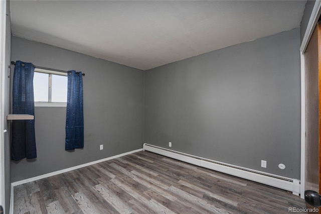 9940 N Calhan Hwy, Calhan, CO 80808 - spare room with a baseboard heating unit and wood finished floors