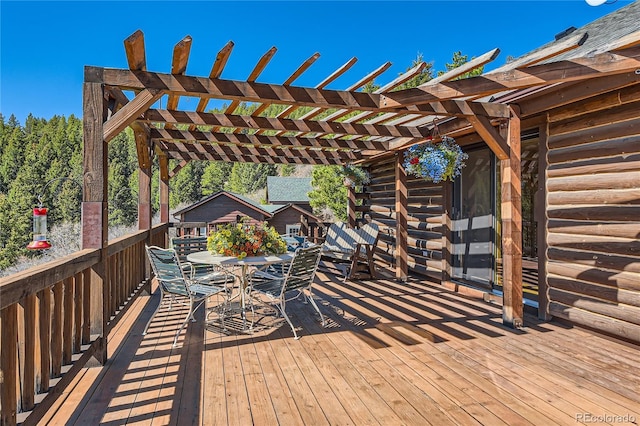 10450 Hondah Dr, Littleton, CO 80127 - wooden terrace featuring a pergola and outdoor dining space