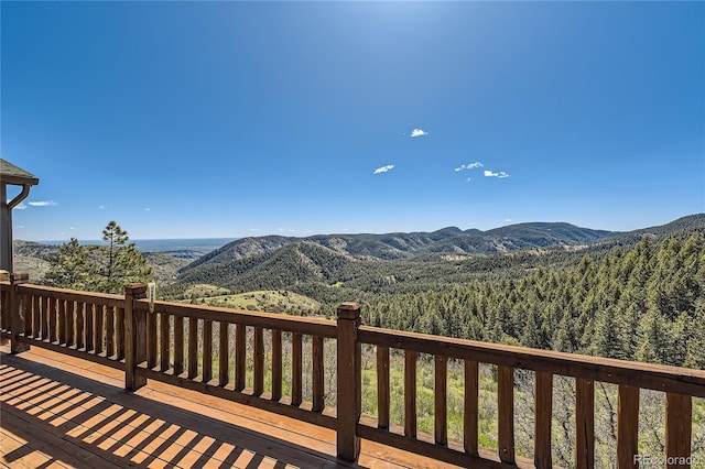 10450 Hondah Dr, Littleton, CO 80127 - deck featuring a mountain view and a forest view