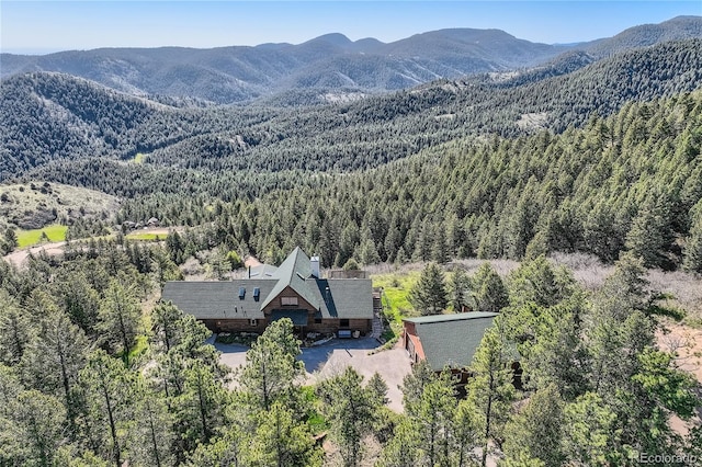 10450 Hondah Dr, Littleton, CO 80127 - view of mountain backdrop featuring a heavily wooded area