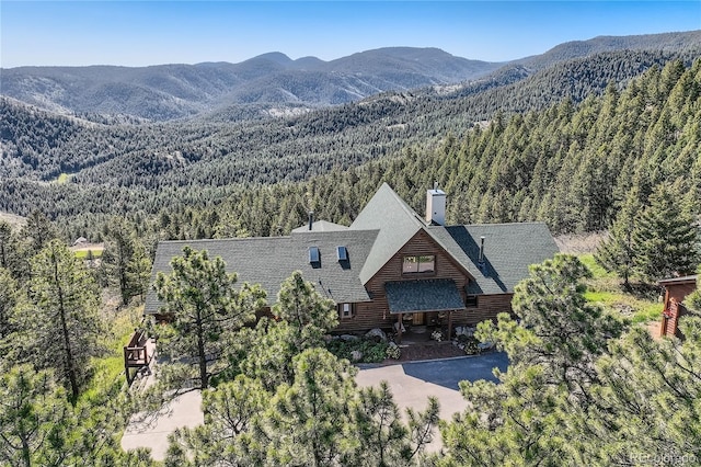 10450 Hondah Dr, Littleton, CO 80127 - view of mountain background with a forest