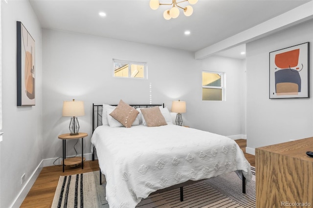 1220 Ash St, Denver, CO 80220 - bedroom with an inviting chandelier, wood finished floors, baseboards, and recessed lighting