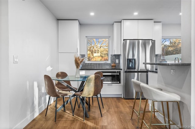 1220 Ash St, Denver, CO 80220 - dining space with recessed lighting and wood finished floors
